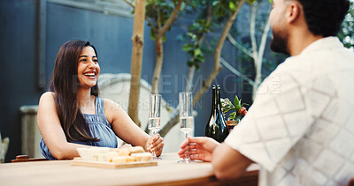 Buy stock photo Anniversary, bonding and champagne with couple at table of restaurant together for celebration or romance. Alcohol, love and relationship with people on date for hospitality, milestone or support