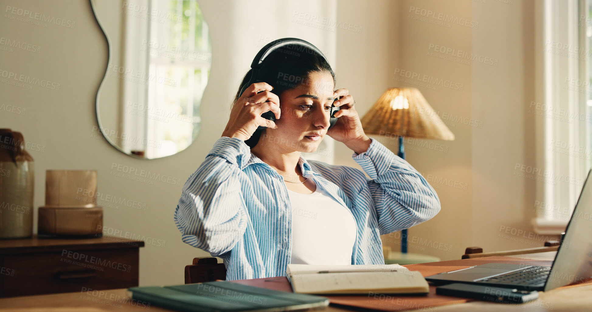 Buy stock photo Laptop, woman and listening with headphones in home for audio transcription, editing and remote work. Freelancer, transcriber and tech at desk for playback software, video recording and proofreading