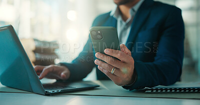 Buy stock photo Hands, laptop and phone with business man at desk in glass office for accounting feedback. App, computer and investment management with broker typing text message in financial workplace for review