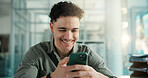 Break, social network or happy man with phone in office, watch funny video or reading joke message. Smile, reading or employee with mobile in workplace, check comic blog or browsing internet for meme