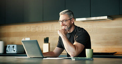 Buy stock photo Laptop, remote work and smile with man in kitchen of home for planning, report or research. Computer, reading and small business startup with mature freelancer in apartment for schedule or review