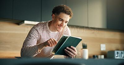 Buy stock photo Remote work, search and tablet with happy man in kitchen of home for online planning or report. App, reading and small business startup with freelance employee in apartment for schedule or review