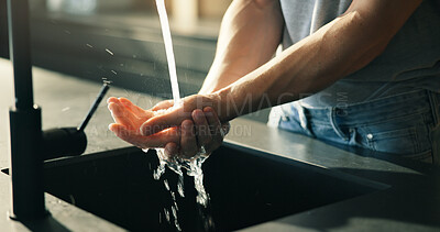 Buy stock photo Person, washing hands or rinsing in kitchen with water for hygiene, disinfection or bacteria prevention. Man, wellness or cleaning skin in home with faucet for liquid, dermatology or germ protection.