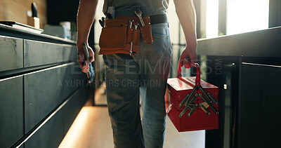Buy stock photo Walking, tool box and back of man in home for maintenance, service or repair job in kitchen. Equipment, customer care and male contractor with plumbing career at client house for leak inspection.