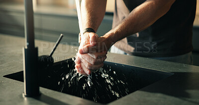 Buy stock photo Water, person and washing hands in kitchen for cleaning skin, health or wellness for morning routine. Rinse, tap and man in home for hygiene, germ prevention and self care for bacteria safety