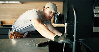 Buy stock photo Maintenance, repair and tap with plumber in kitchen of home for installing or testing water supply. Checking, faucet and plumbing fix with man in apartment for inspection or renovation as contractor