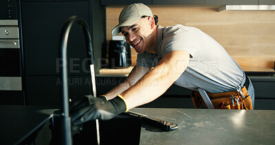 Buy stock photo Faucet, maintenance and repair with plumber in kitchen of home for installing or testing water supply. Checking, plumbing fix and tap with man in apartment for inspection or renovation as contractor