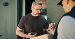 Delivery, package and phone payment with man at front door of home for receipt of online order. Box, courier and retail transaction with customer at entrance to apartment for ecommerce shipping