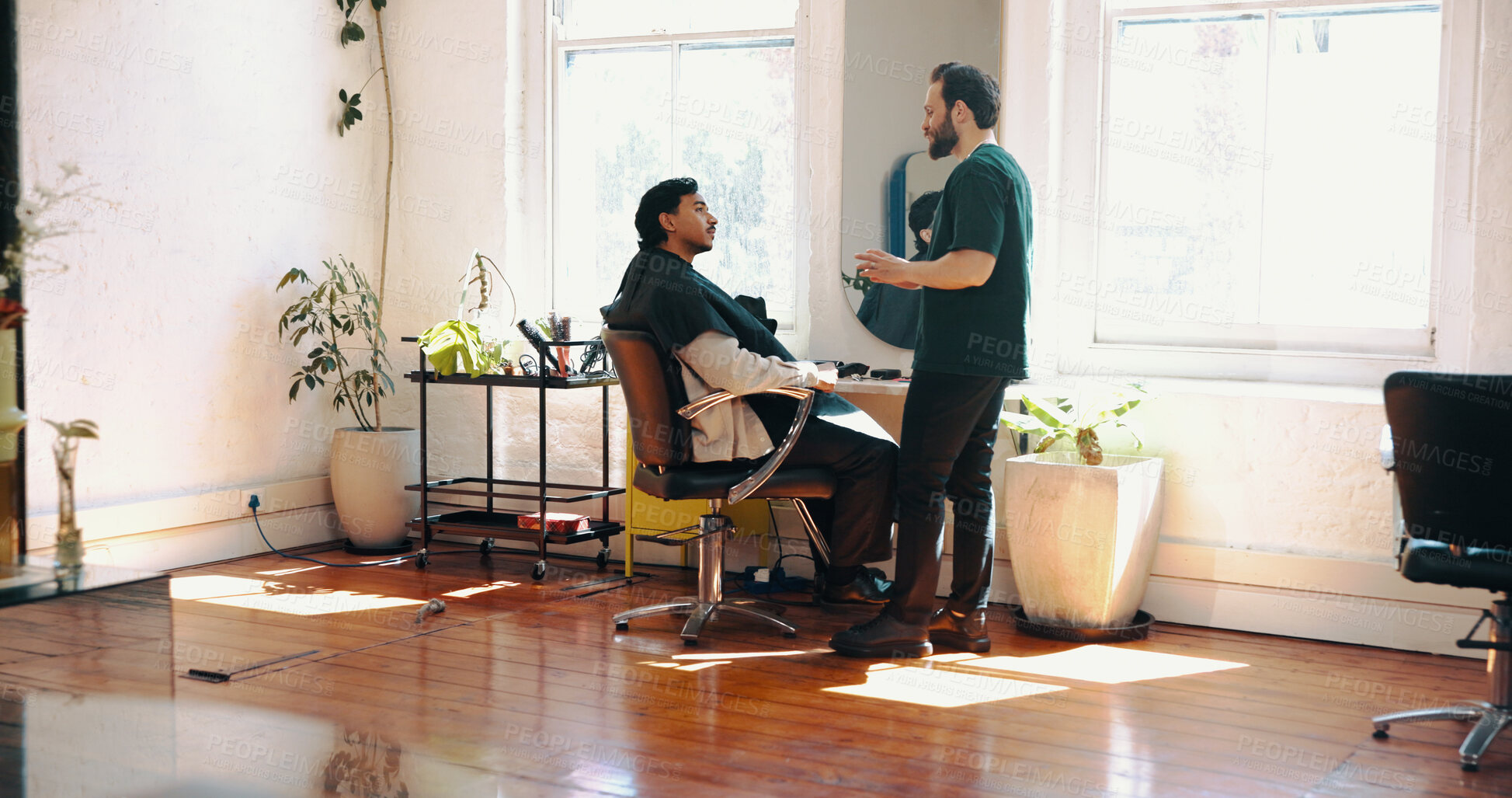 Buy stock photo Man, barber and talk with client for hairstyle choice, offer and explain services at salon. People, hairdresser and discussion with decision for grooming, haircut or conversation at barbershop