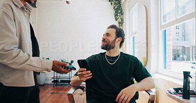 Buy stock photo Happy man, hairdresser or client with phone for payment, banking app or pos machine in salon. Male people, barber or customer with mobile smartphone for tap to pay or wireless transaction in parlor