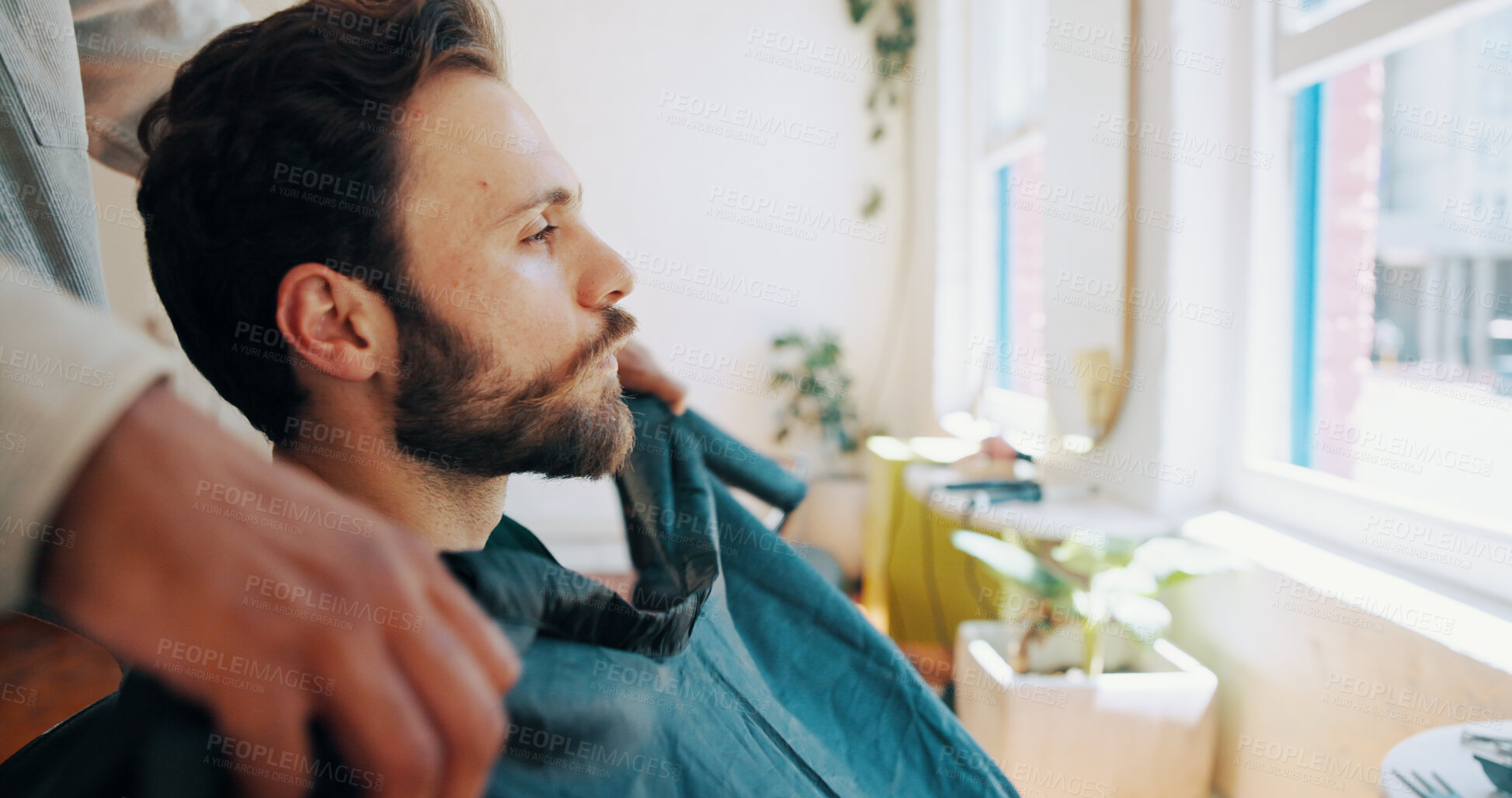 Buy stock photo Man, barber and profile with preparation for haircut, styling or grooming in barbershop. Male person, hairdresser or getting ready with stylist with cape, trim or cut hairstyle in beauty parlor