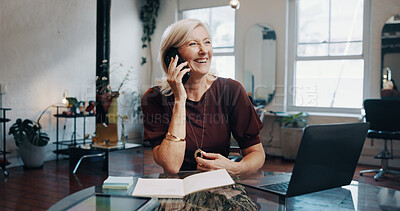 Buy stock photo Phone call, smile and thinking with woman at desk in small business startup for contact or feedback. Conversation, laptop and notebook with mature employee in office for communication or consulting