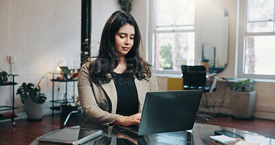 Buy stock photo Woman, typing and browsing in salon with laptop for client appointment update, calendar or email. Person, plan or reading in hairdresser with computer for customer schedule, online booking and admin.