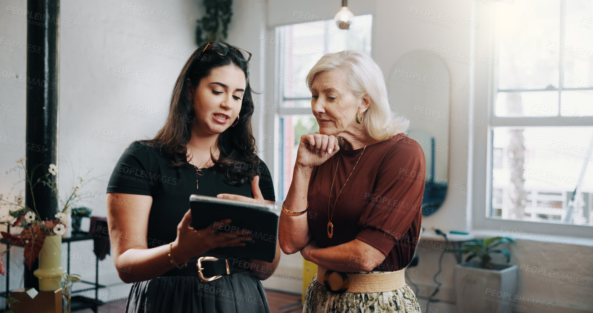 Buy stock photo Woman, hairdresser and team with tablet, discussion and planning with review for schedule at shop. People, small business partnership and tech with app, talk or checklist for salon supplies at store