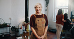 Mature woman, portrait and happy at hairdresser with career, confidence and pride for grooming service at store. Person, entrepreneur and smile at salon, job or apron for hairstyle at beauty parlor
