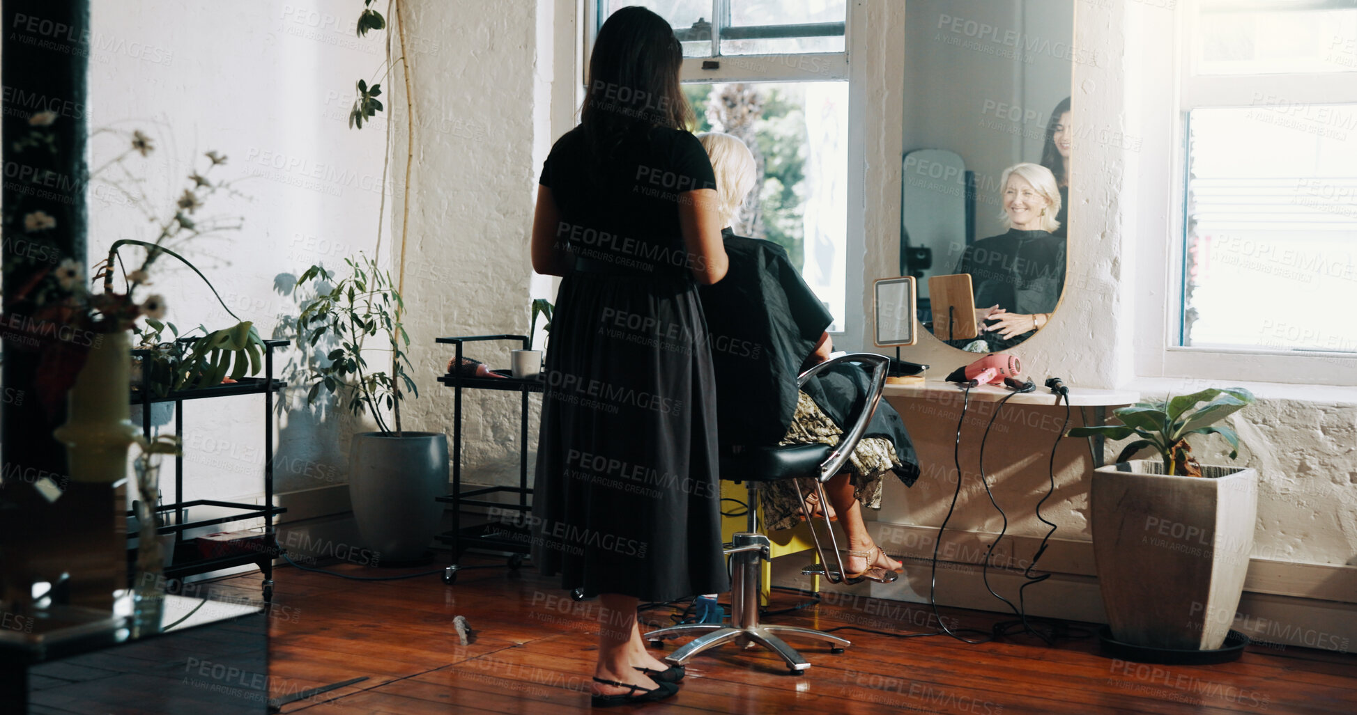 Buy stock photo Back, mirror and styling with people at hairdresser for appointment, consulting or treatment. Check, reflection or service with hair stylist and mature client in salon for haircare or maintenance