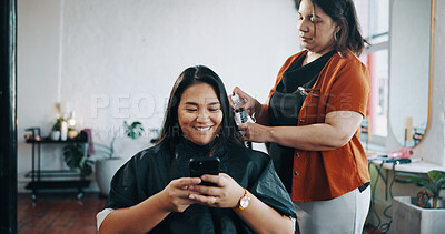 Buy stock photo Phone, hairstylist and smile with woman in salon for cosmetology, beauty and stylist rating. Hairdresser, online review and customer experience with person in studio for hair care, rinse and makeover