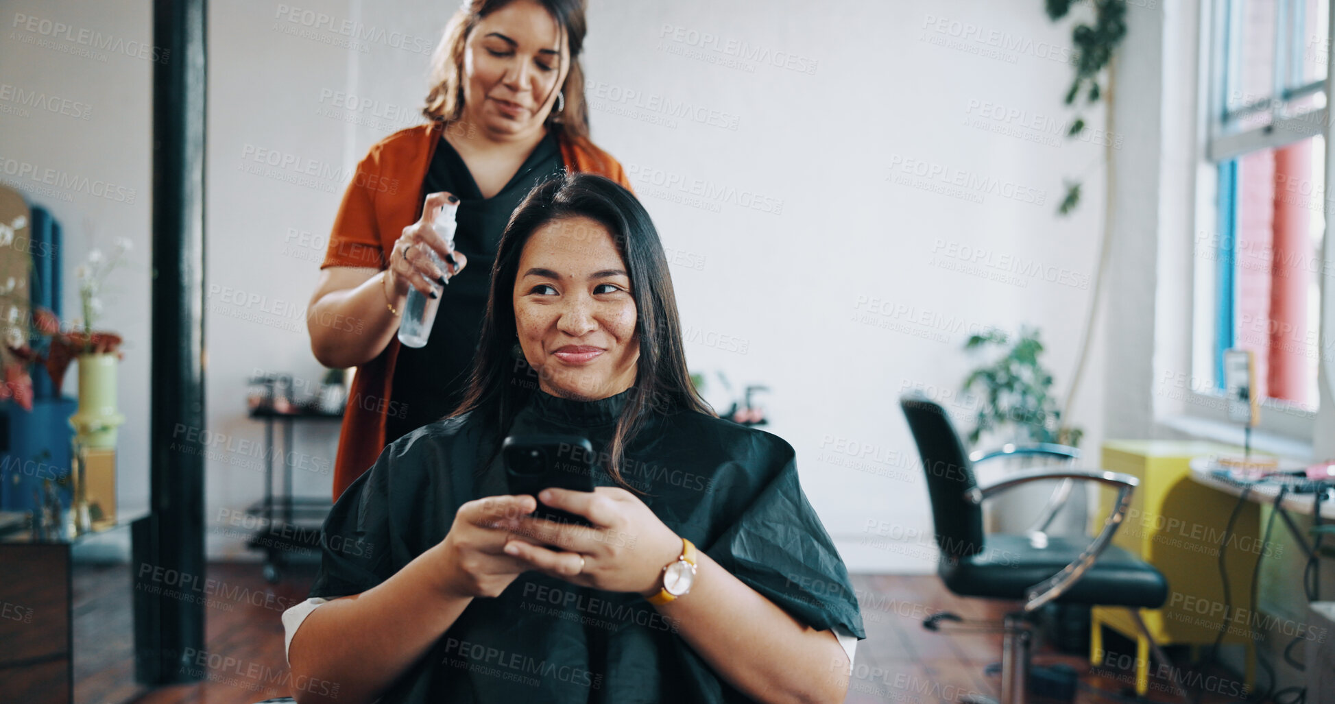 Buy stock photo Hairspray, phone and styling with woman at hairdresser for appointment, consulting or treatment. Mobile, service and volume product with happy customer in hair salon for maintenance or restoration