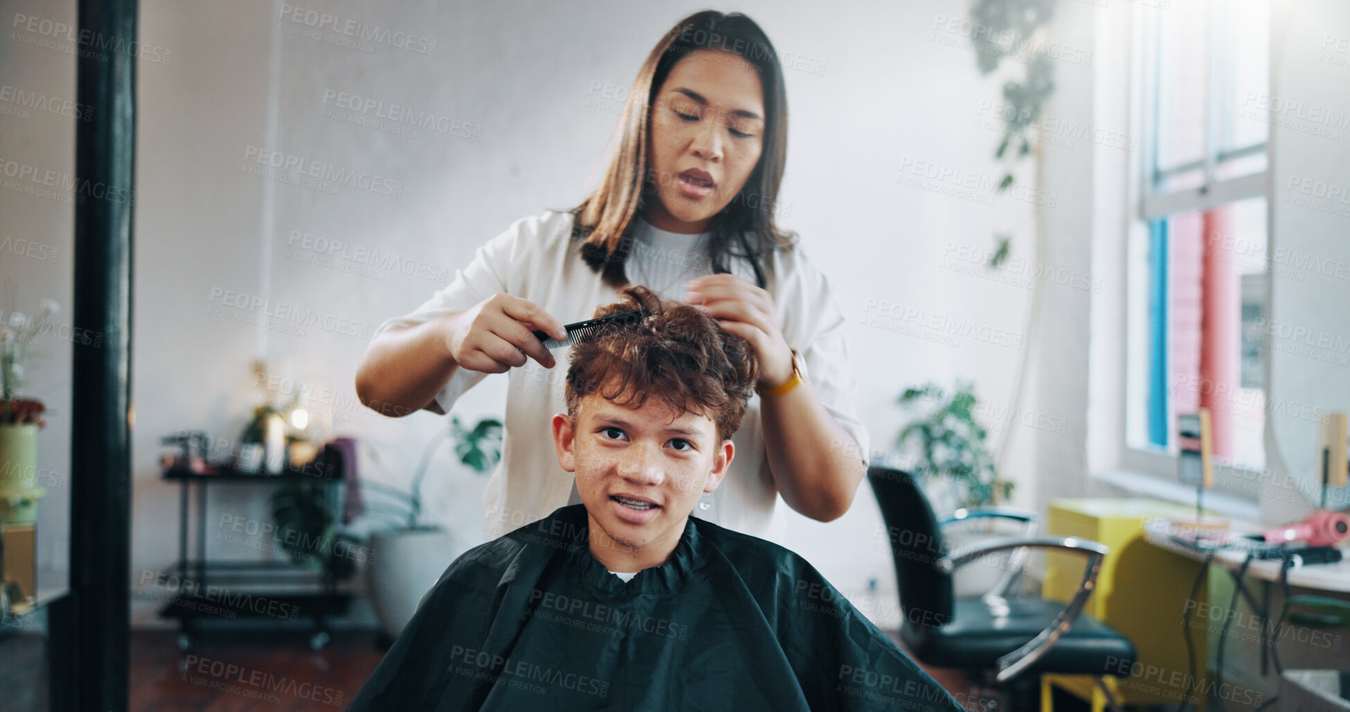 Buy stock photo Cutting, hairdresser and child with cape, woman and hair maintenance with equipment. Consultation, appointment and person with boy for haircut, grooming and process with confidence and teenager