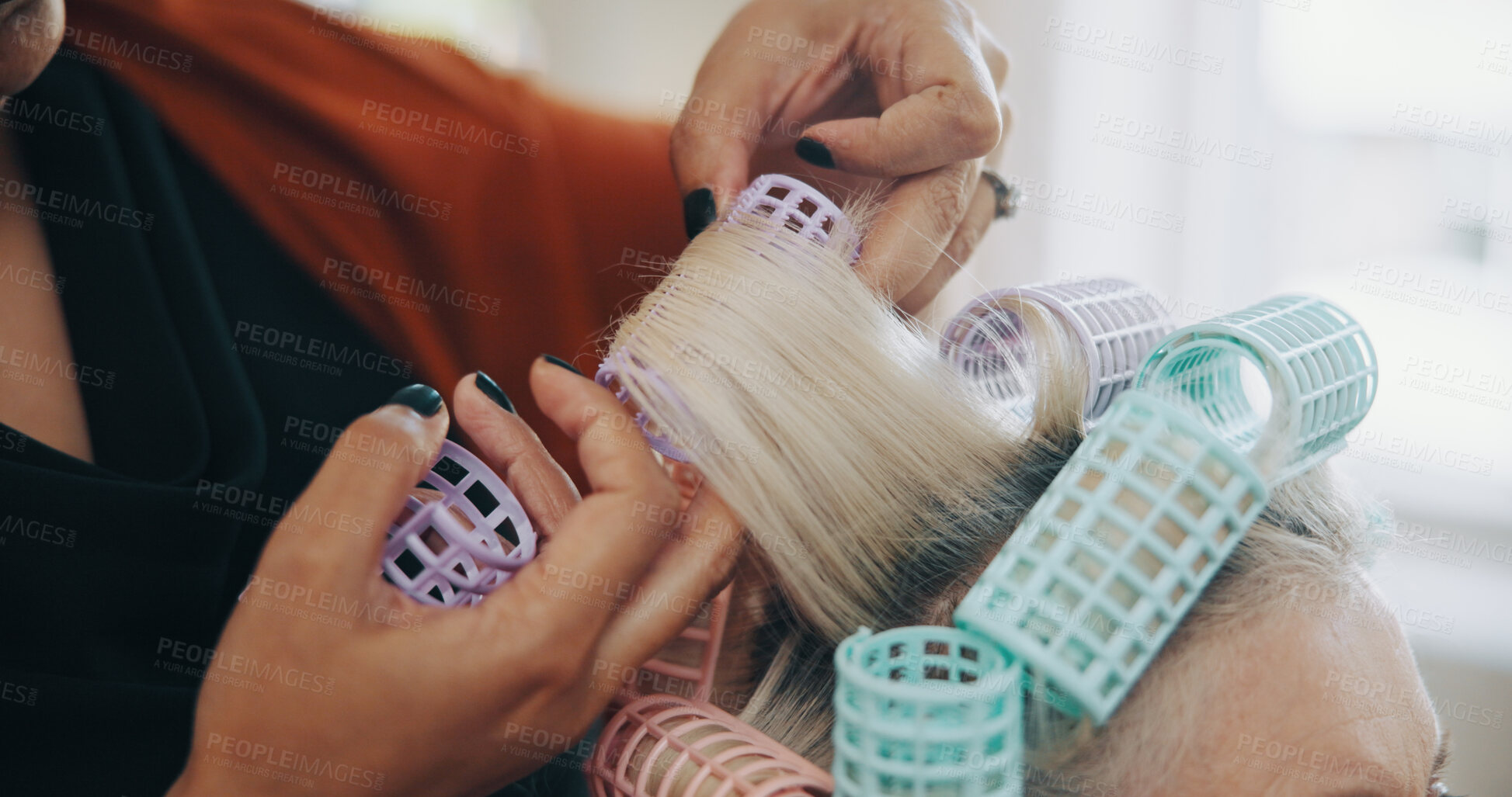 Buy stock photo Hands, hairstylist and curlers with woman in salon for cosmetology, beauty and grooming. Hairdresser, parlor and customer makeover with people in store for hair care appointment, relax and rollers
