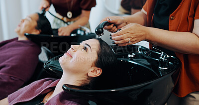 Buy stock photo Hairdresser, customer or women at beauty salon basin, professional service or washing scalp to clean. Rinse, shampoo treatment or client with stylist for hair care routine, people or faucet for water