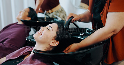 Buy stock photo Hairdresser, customer or happy woman at wash basin in salon, professional service or clean scalp. Rinse, shampoo treatment or people with stylist for hair care routine, grooming or faucet for water