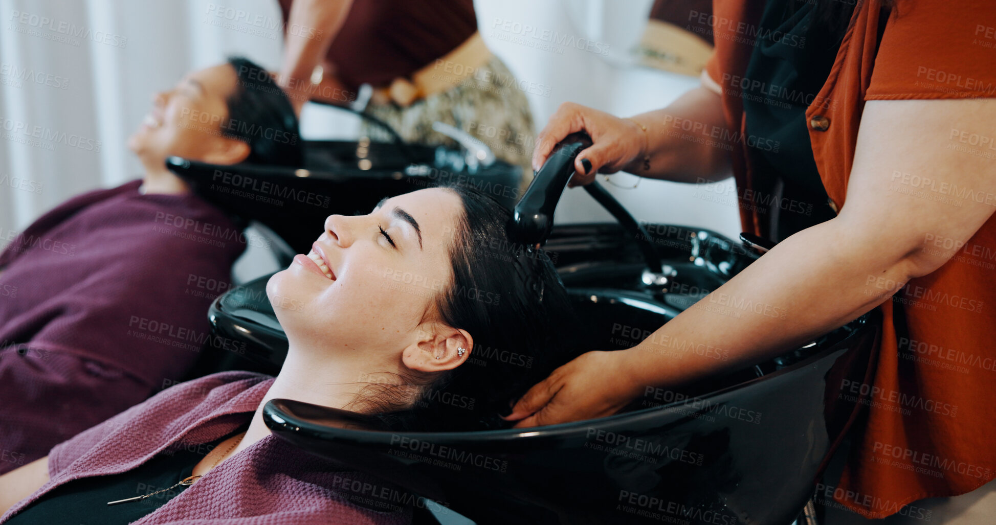 Buy stock photo Hairdresser, customer or happy woman at wash basin in salon, professional service or clean scalp. Rinse, shampoo treatment or people with stylist for hair care routine, grooming or faucet for water