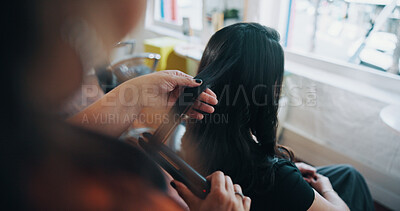 Buy stock photo Hands, hairstylist and flat iron with woman in salon for cosmetology, beauty and grooming. Hairdresser, parlor and customer makeover with people in store for hair care, relax and straightener