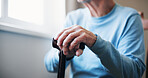 Cane, thinking and hands with old man and window in home for retirement, Parkinson and reflection. Memory, walking stick and mobility aide with senior person with a disability in house for vision