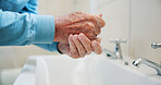 Bathroom, soap and senior person with washing hands in home for health, hygiene or wellness. Retirement, sink and cleaning skin for removal of dirt, bacteria or dust for disinfection in house.