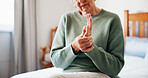 Senior woman, massage and hand pain at house from arthritis, carpal tunnel and muscle inflammation. Closeup, elderly person and discomfort of pinched nerve, fibromyalgia and joint cramps from sprain