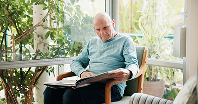 Buy stock photo Senior man, reading book and relax in living room with story, literature and novel in retirement at house. Elderly person, information and knowledge with language, fiction or learning in nursing home