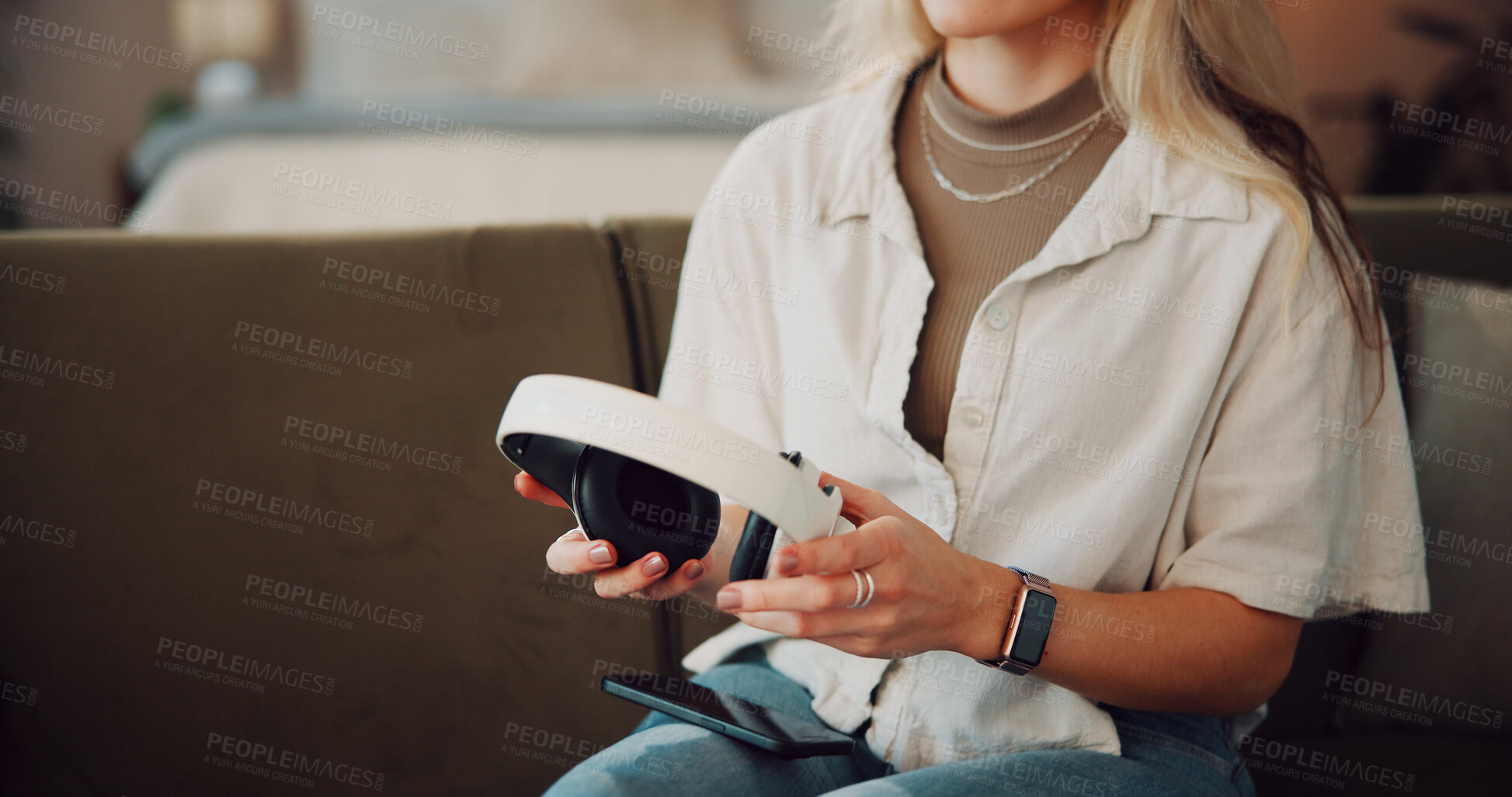Buy stock photo Hands, woman and headphones with phone at house for connection, streaming and listening to music. Female person, mobile and browsing internet for latest album, download podcast and app subscription
