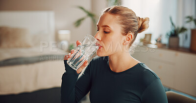 Buy stock photo Fitness, woman and drink water in home for health, wellness or nutrition on break with glass. Exercise recovery, hydration or thirsty person with liquid in bedroom for detox, electrolytes or minerals