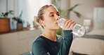 Fitness, woman or drink water in home for wellness, health or nutrition on break with bottle. Exercise recovery, hydration or thirsty person with liquid in bedroom for detox, electrolytes or minerals