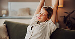 Woman, stretching and rest on living room sofa for weekend break and breathe in home. Relax, tired and person ready for nap on couch in house with peace, sleep and chilling in lounge for self care