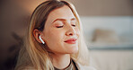 Woman, earphones and music with smile in home, eyes closed and inspiration with audio in lounge. Person, happy and listen with streaming subscription, relax and sound in living room at apartment