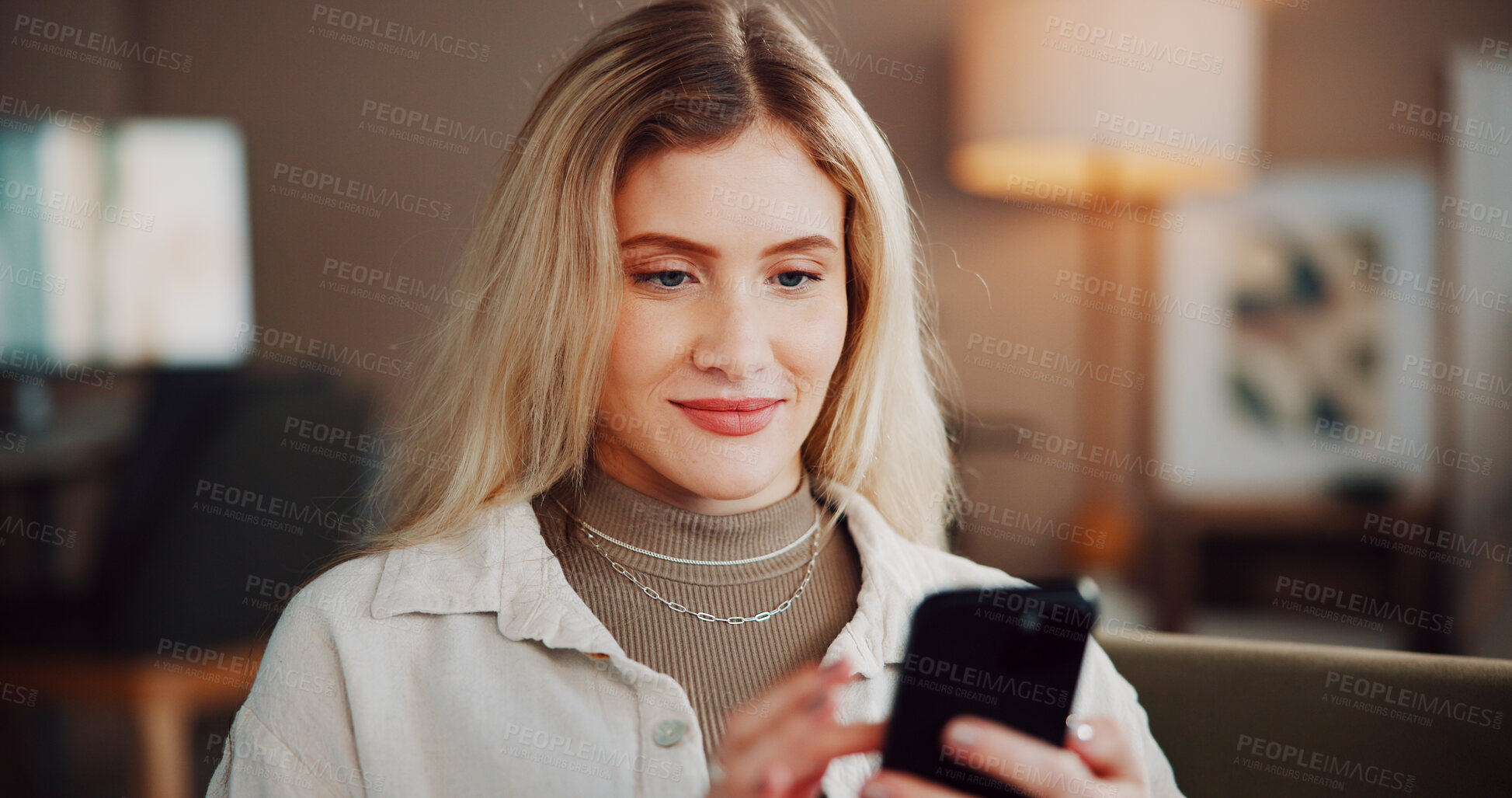 Buy stock photo Phone, happy and woman in home for communication, email or networking on mobile app in living room. Smile, technology and female person with cellphone for social media, texting or online in apartment
