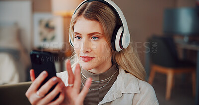 Buy stock photo Woman, headphones and phone with music in home, scroll and choice for song on web in living room. Person, smartphone and listen with audio on mobile app, streaming subscription or relax at apartment