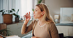 Thirsty, woman and drinking water in bedroom with glass for wellness, vitamins and hydration benefits. Female person, swallow liquid and beverage in house for fresh aqua, cold fluid and healthy diet.