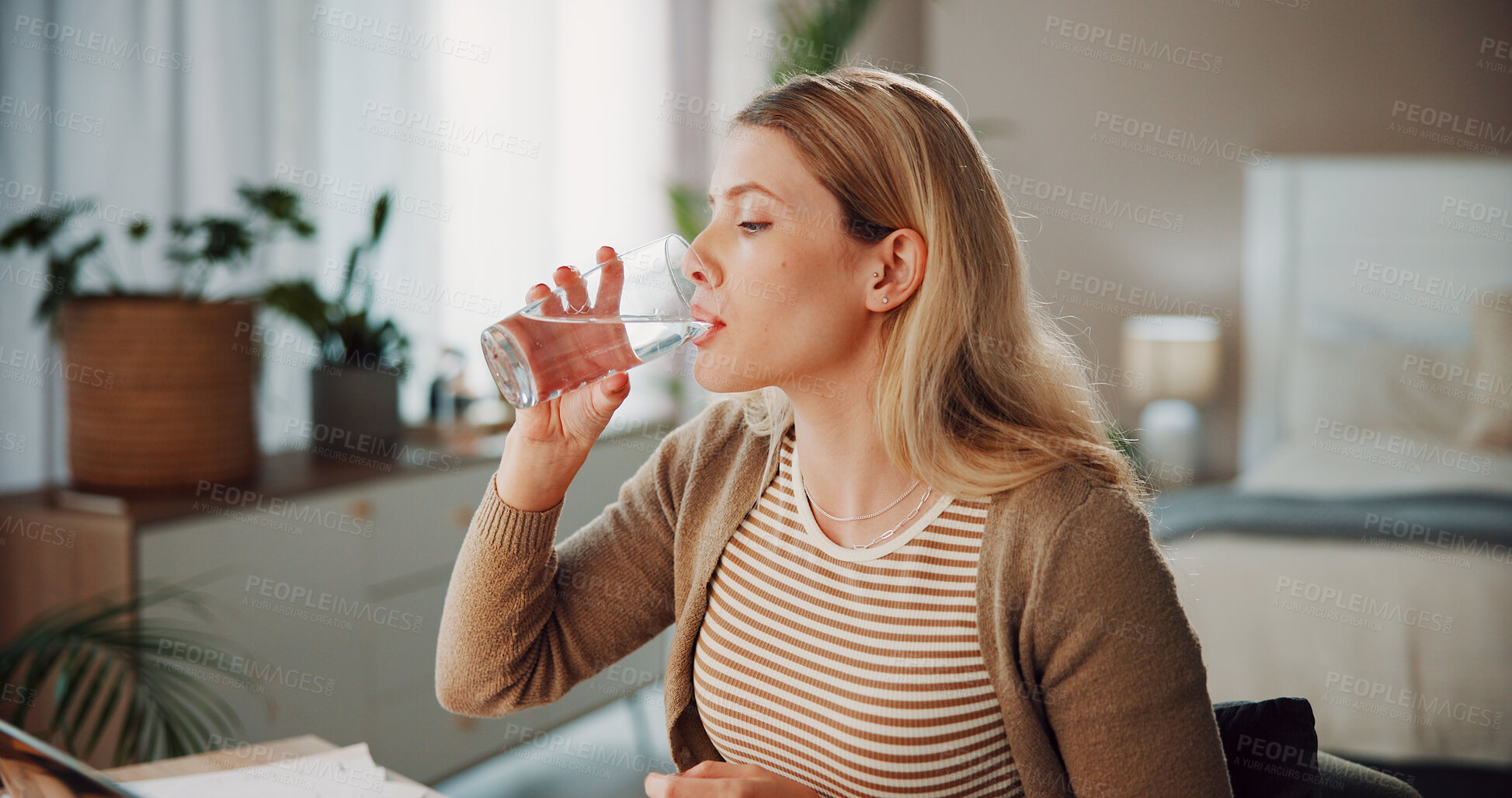 Buy stock photo Thirsty, woman and drinking water in bedroom with glass for wellness, vitamins and hydration benefits. Female person, swallow liquid and beverage in house for fresh aqua, cold fluid and healthy diet.
