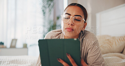 Buy stock photo Tablet, glasses and reading of woman in bedroom for social media, streaming service and comment update. Connection, online chat forum and post with person and tech in home for communication and app