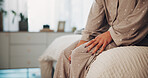 Home, hands and woman in bedroom, knee pain and sore leg with fibromyalgia, muscle stress or ache. Apartment, joint injury or person with arthritis, strain or sprain with osteoporosis or inflammation