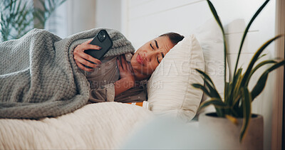 Buy stock photo Woman, phone and sad in bed with pills, addiction or breakup with texting in home. Person with depression, smartphone and frustrated with mobile app, notification and opioid crisis at apartment