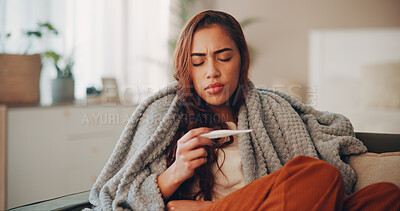 Buy stock photo Sick, woman and thermometer in home for virus infection, influenza or allergy on living room sofa. Girl, winter and fever with high temperature in lounge, cold or medical health problem with blanket