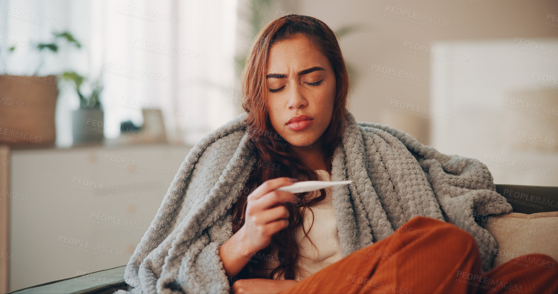 Buy stock photo Sick, woman and thermometer in home for virus infection, influenza or allergy on living room sofa. Girl, winter and fever with high temperature in lounge, cold or medical health problem with blanket