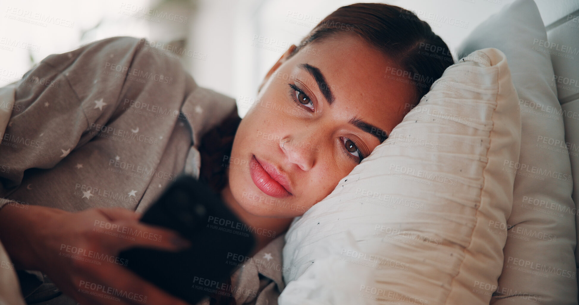 Buy stock photo Woman, phone and texting in bed, home and scroll with chat, check notification or post on web. Person, smartphone and tired with click on mobile app, pyjamas or contact on social network at apartment