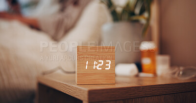 Buy stock photo Digital alarm, time and bedroom in home for sleep schedule, person or rest for wellness. Electronics clock, watch and LED display for reminder, prescription pills or tired with comfort at apartment