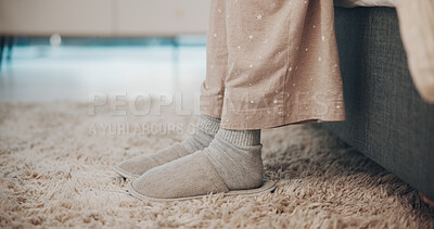 Buy stock photo Feet, slippers and wake up in bedroom, morning and floor for comfort, relax and pyjamas in home. Person, legs and shoes with rest for wellness, chill or footwear on carpet for break at apartment