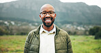 Portrait, relax and black man with smile by field, winter vacation or weekend nature walk for wellness. Day off, outdoor hike and person with positive attitude for holiday, glasses or happy for break